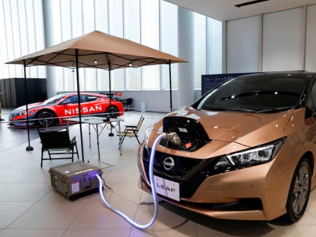 a nissan leaf ev car and portable battery on display at nissan gallery in yokohama japan november 29 2021 photo reuters